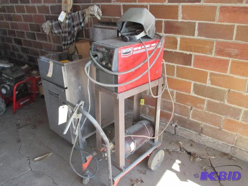 lot 57 image: Century wire feed welder. Comes with cart and...