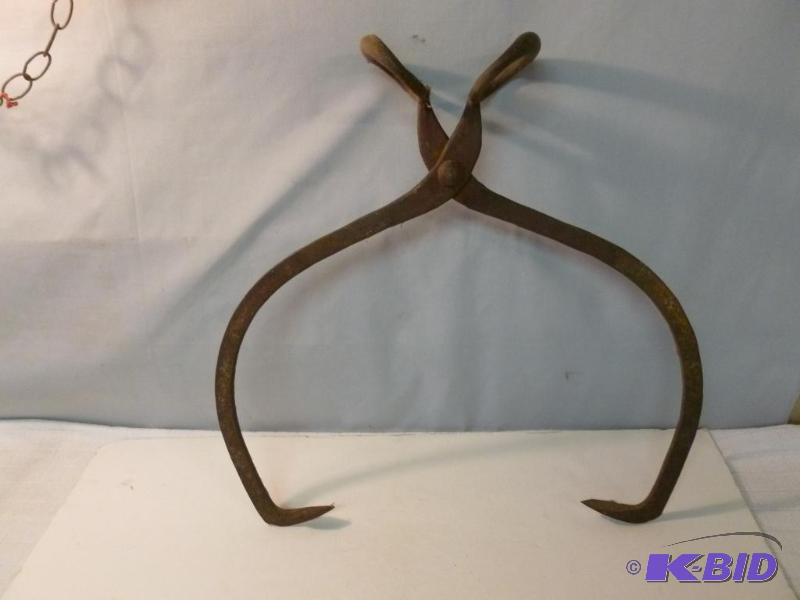lot 111 image: A pair of heavy duty ice tongs that measure 1...