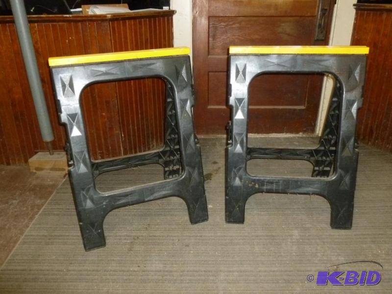 lot 139 image: A pair of heavy gage plastic saw horses....