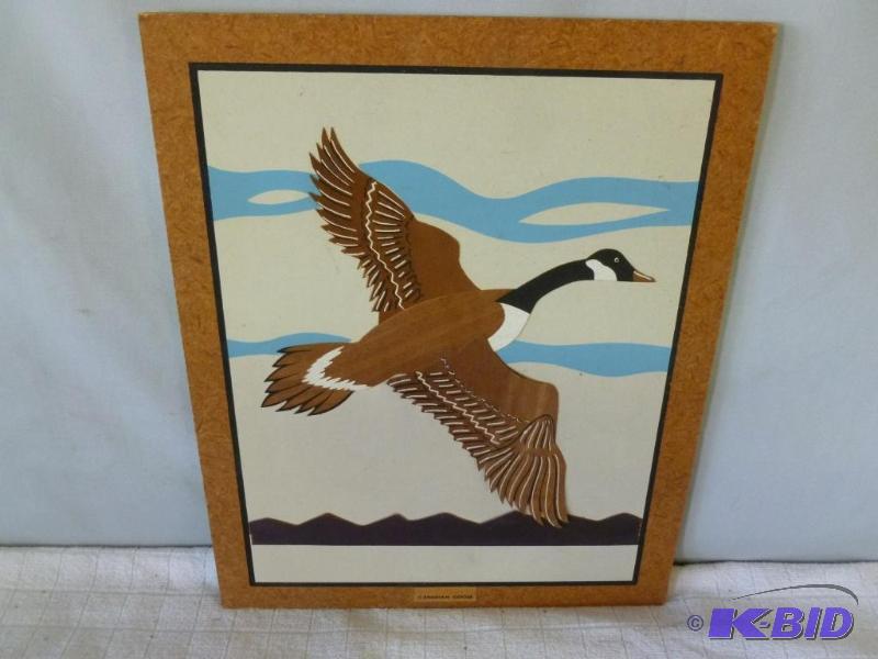 lot 21 image: Canadian Goose wood scroll art on wall plaque...