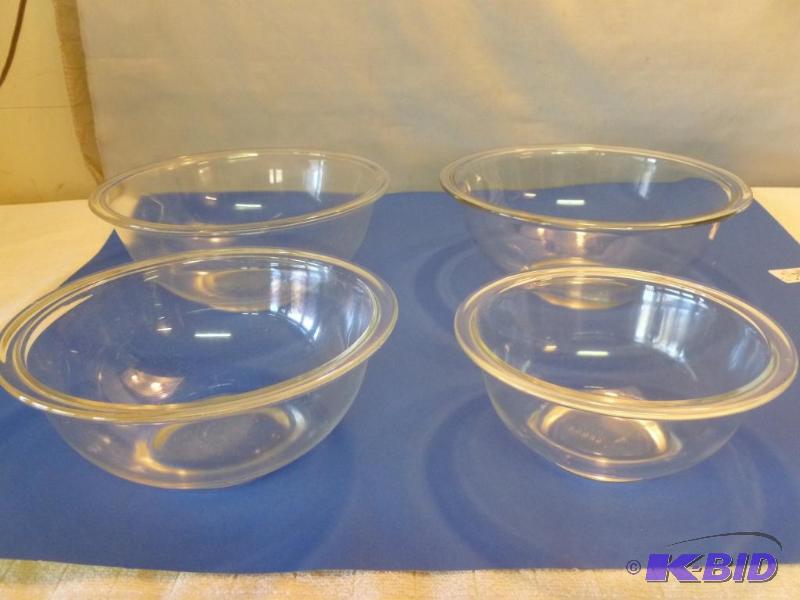 lot 221 image: Pyrex four piece glass mixing bowl set....