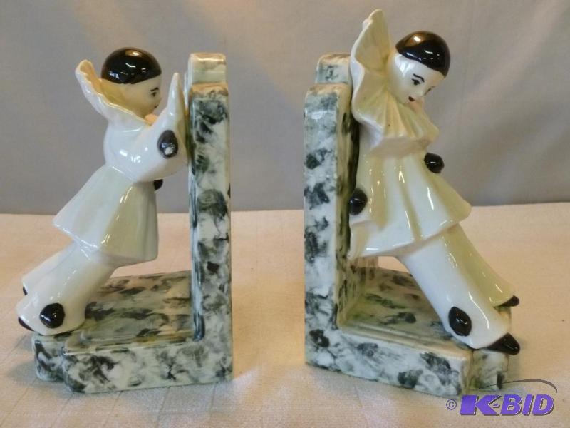 lot 242 image: A pair of porcelain clown bookends that measu...