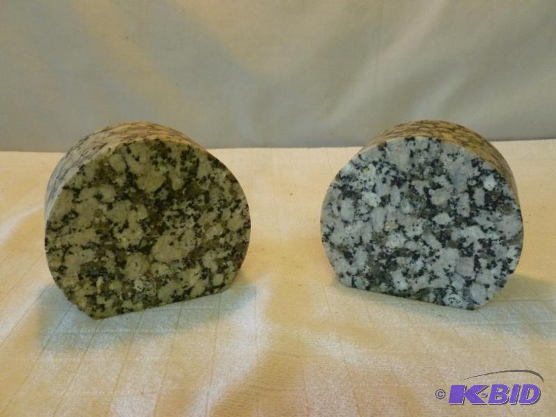 lot 243 image: A pair of heavy granite bookends that measure...