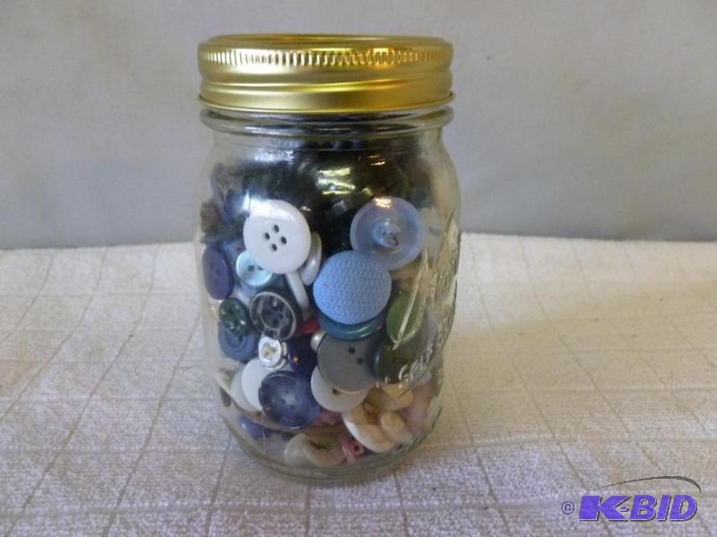 lot 37 image: Mason canning jar filled with mixed vintage b...
