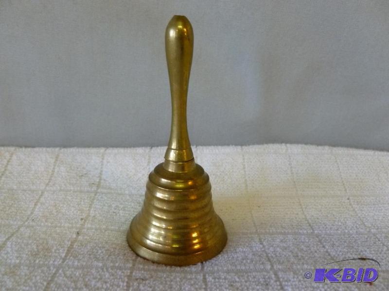 lot 38 image: Cast brass dinner bell, measures 4" H....
