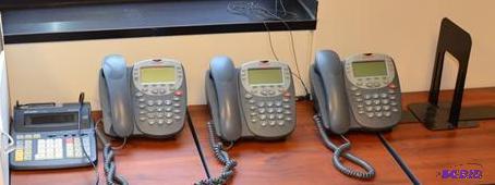 lot 13 image: Three Avaya phones model 5410 One Sharp calcu...