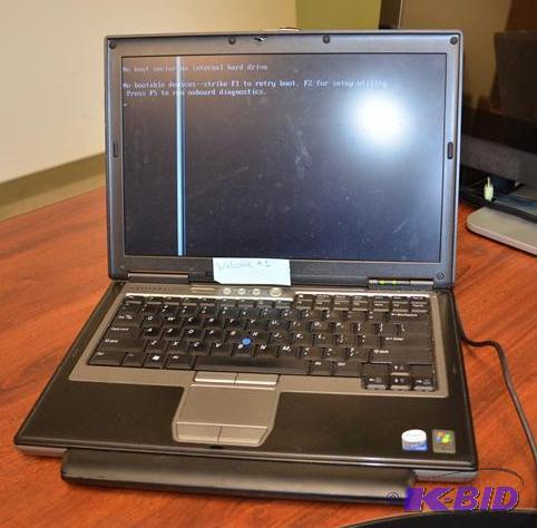 lot 28 image: Dell Latitude D620 laptop computer, powers up...