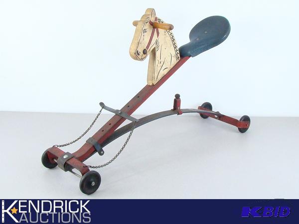 lot 1 image: Vintage Metal Horse Riding Toy with Wood Horse Head