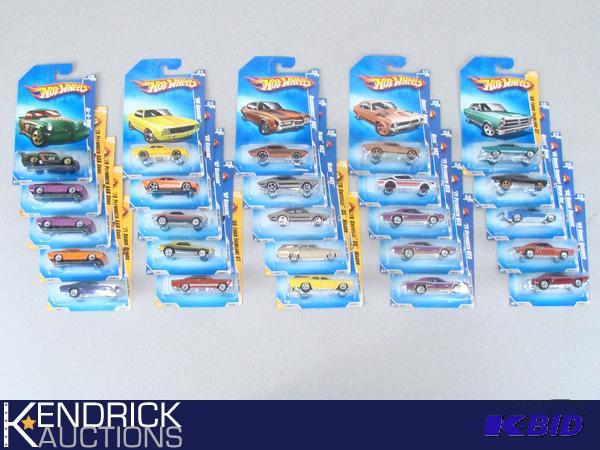 lot 63 image: 25 Vintage MINT ON CARD 2009 Hot Wheels
