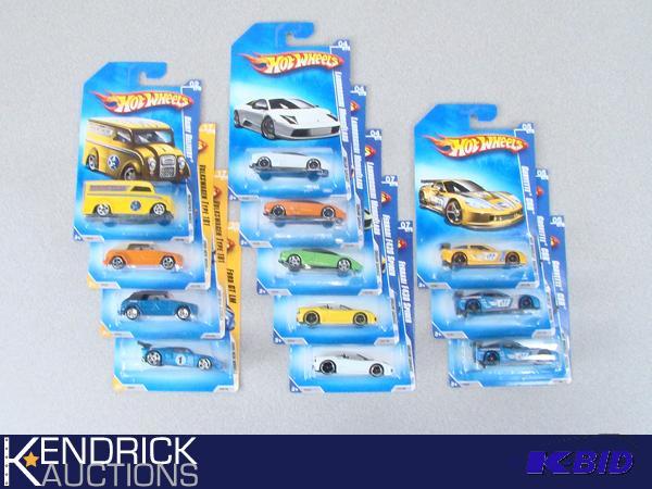 lot 64 image: 12 Vintage MINT ON CARD 2009 Hot Wheels