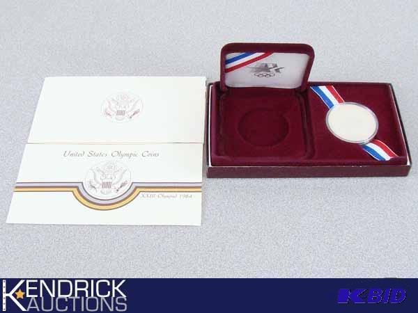 lot 8 image: 1984  U.S. Olympic Proof 90% Silver Dollar