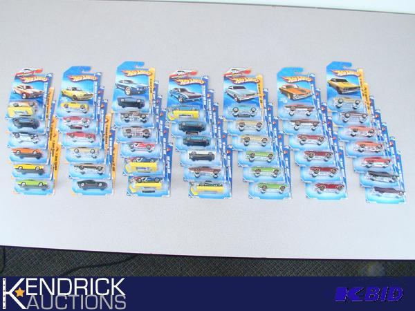 lot 89 image: 43 Vintage MINT ON CARD 2010 Hot Wheels Muscle Type Cars