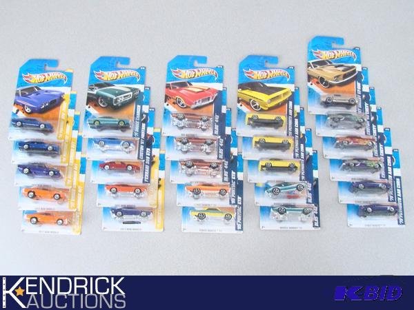 lot 90 image: 26 Vintage MINT ON CARD 2011 Hot Wheels