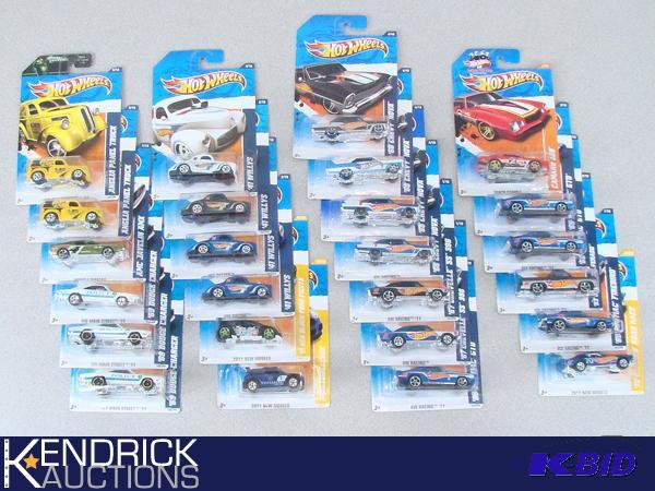 lot 91 image: 25 Vintage MINT ON CARD 2011 Hot Wheels Race Type Cars