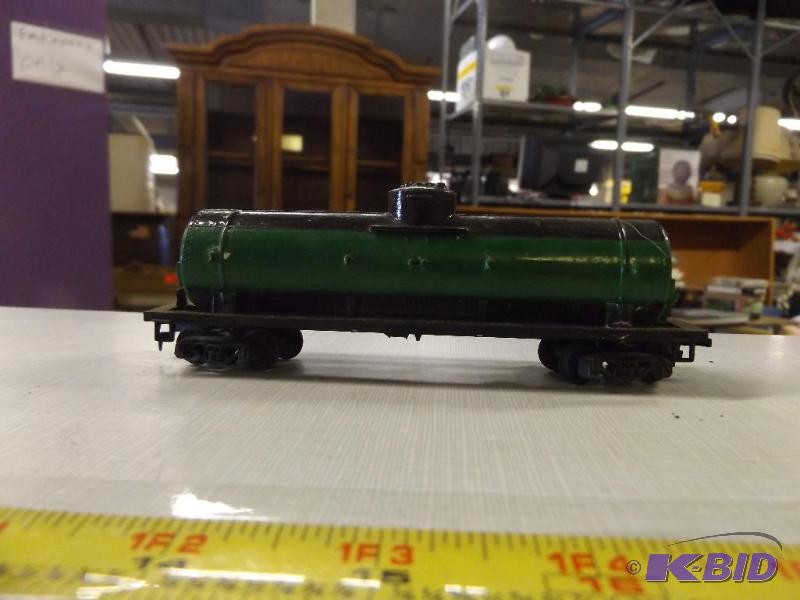 green and black tanker train car...