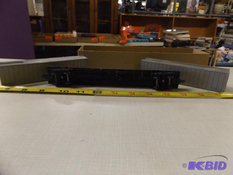 two cargo containers and a flat bed rail car ...