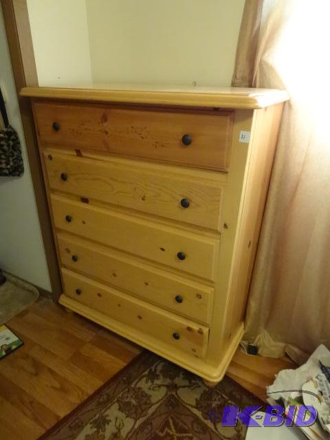 lot 21 image: wood 5 drawer dresser. 37 x 18 x 46. Some dra...