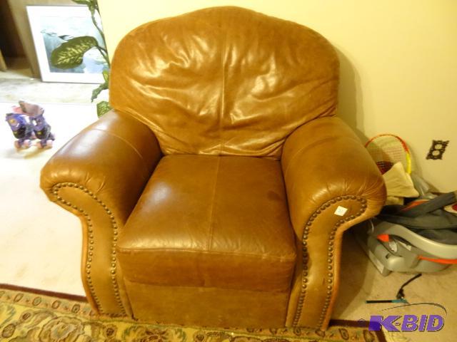 lot 31 image: Real leather sofa chair. No rips or tears. Co...
