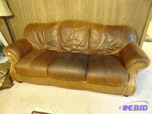 lot 33 image: Leather trend full sized leather sofa. No rip...