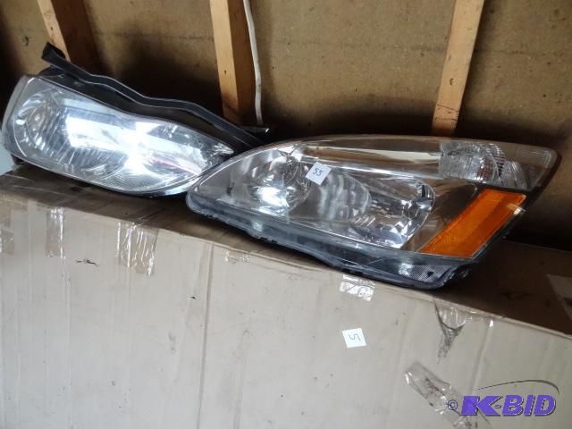 lot 55 image: 2006 Toyota Avalon head lamp assemblies...