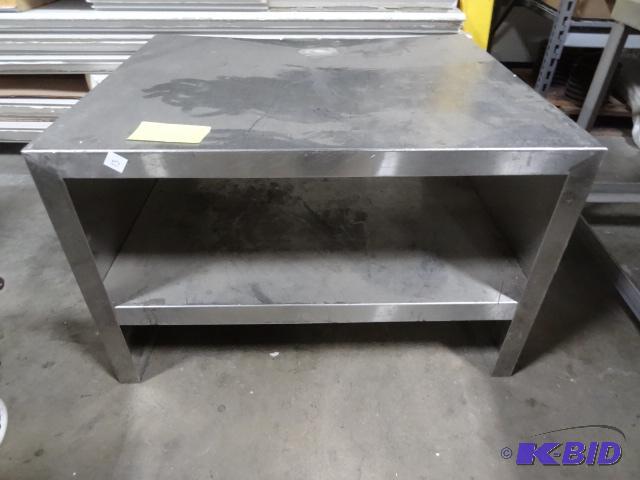 Stainless table. 38 x 32 x 24...
