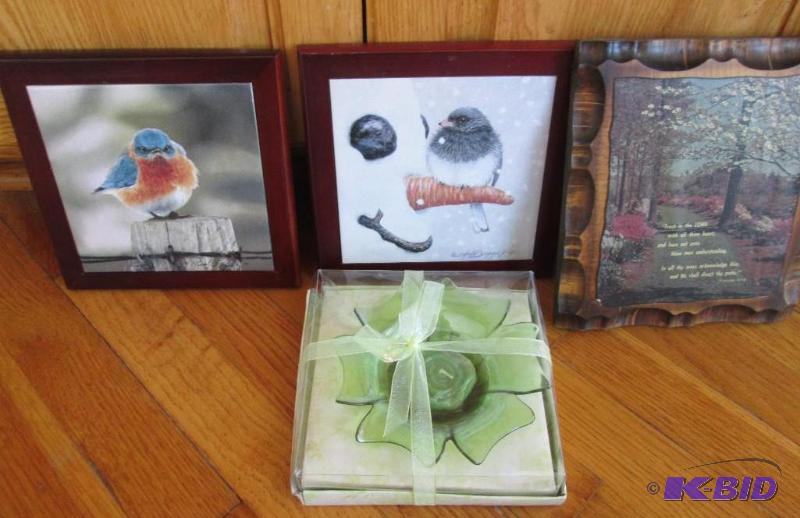 Lot of wall hangings and a candle in holder...