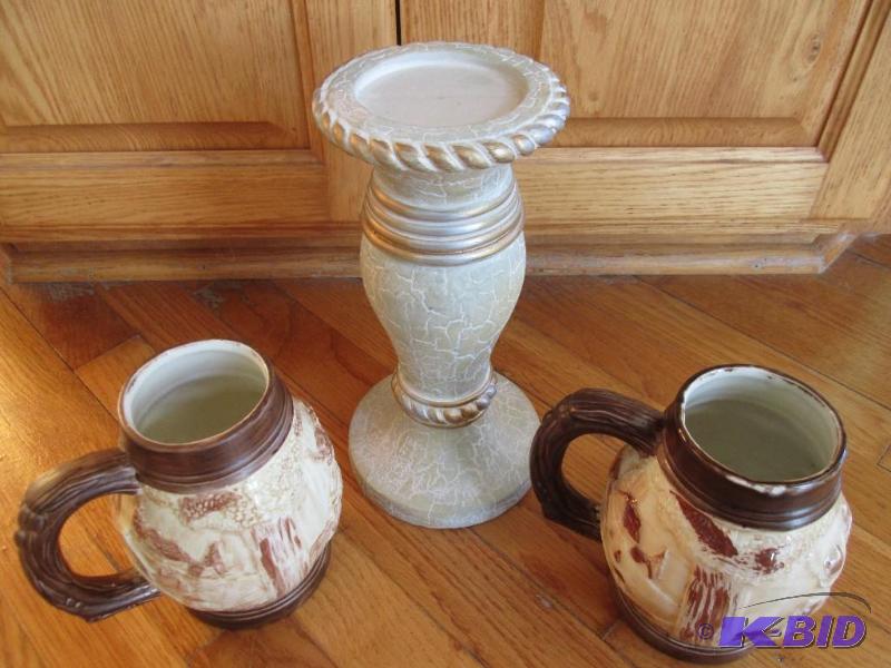 Decorative mugs and a candle pillar...