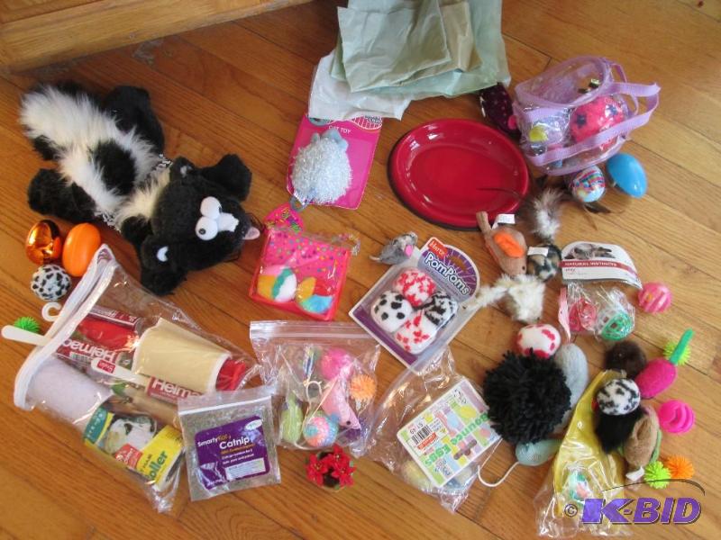 Lot of assorted pet toys and fur rollers, mos...