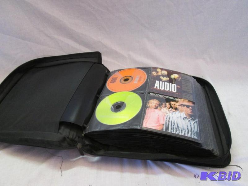 large binder of assorted music CDs see pictur...
