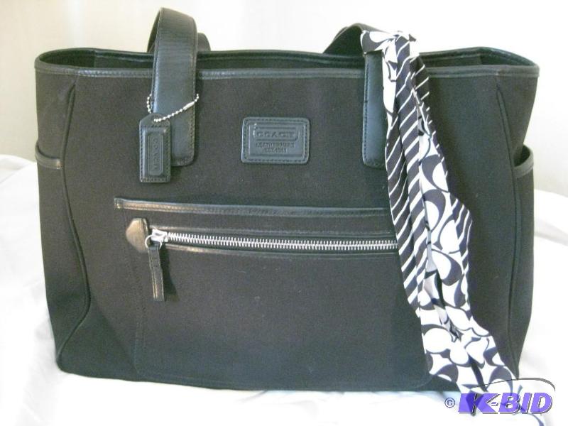 lot 12 image: Large Black Canvas Coach Purse with decorativ...