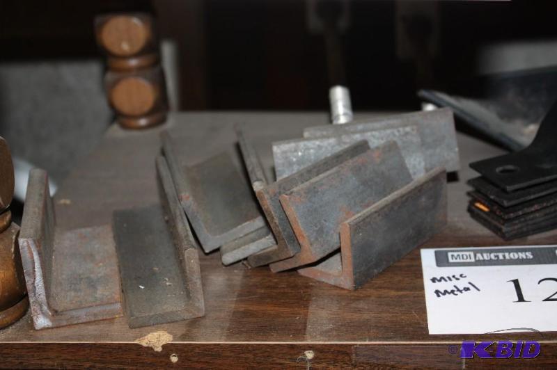 lot 1219 image: Shelf Lot Including Miscellaneous Metal Hardware Angle Bars Pipe Holders And More.