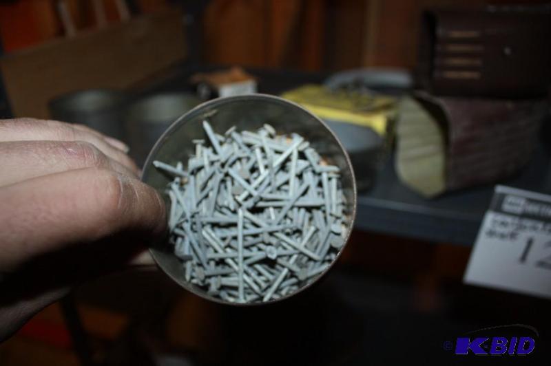 lot 1294 image: Shelf Lot Including Craftsman Brand Hold-Downs Screws Nails and More.