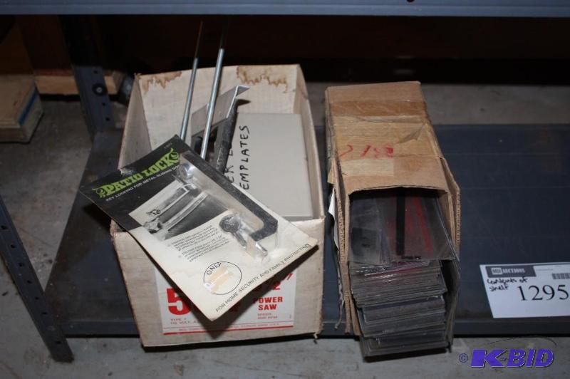 lot 1295 image: Shelf Lot Including 8 Letters For Changeable Copy Signs Router Letter Templates And More.