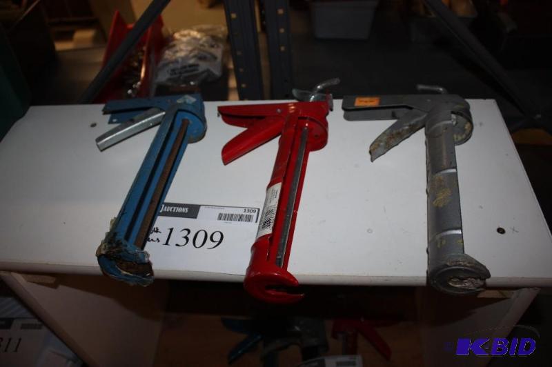 lot 1309 image: Lot of (3) Caulk Guns (1) Blue (1) Red and (1) Grey.