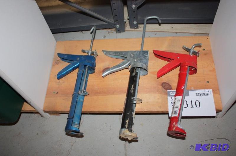 lot 1310 image: Lot of (3) Caulking Guns (1) Red (1) Black and (1) Blue.
