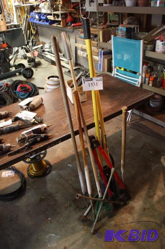 lot 1531 image: Corner Lot Including Rake Hoe Hatchet Cutters And More.