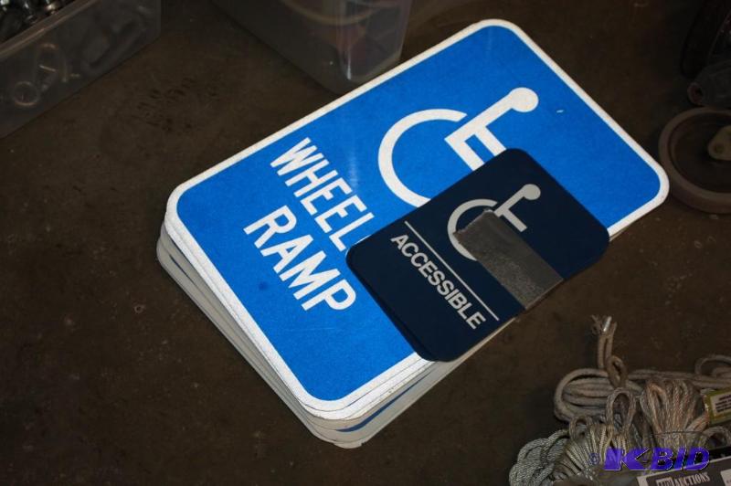 lot 1605 image: Lot of (8) Handicap Signs and (2) Handicap Restroom Signs.