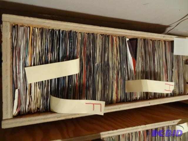 Box full of records. 45s. At least 100 recor...