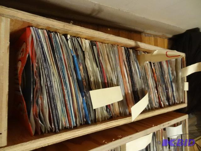 Box full of records. 45s. At least 100 recor...
