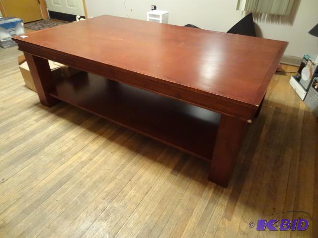 Wood coffee table. Has some wear. 60 x 34 x 2...