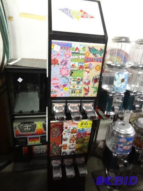 lot 29 image: Stand up 6 column sticker machine. No keys...