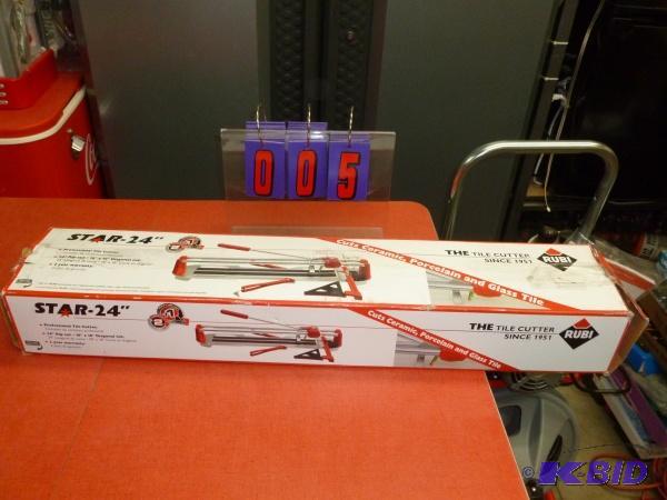 lot 5 image: Rubi star 24" tile cutter. Appears like ...