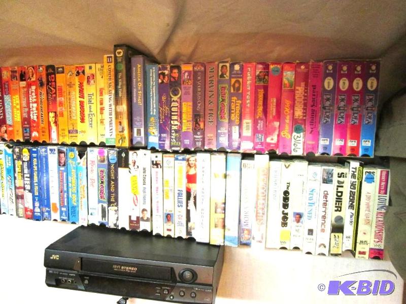lot 152 image: huge lot of VHS movies with a JVC Hi-Fi stere...
