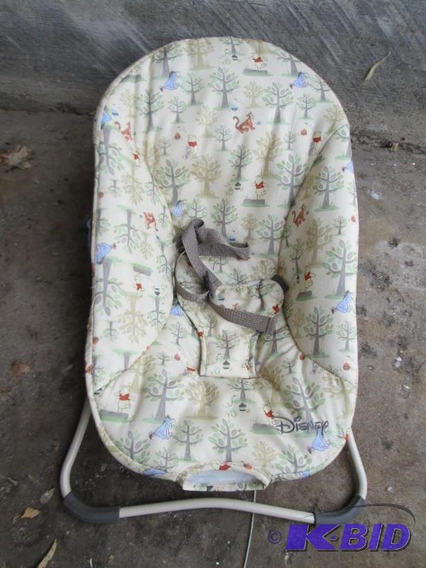 lot 443 image: Disney Pooh theme bouncy chair, used...