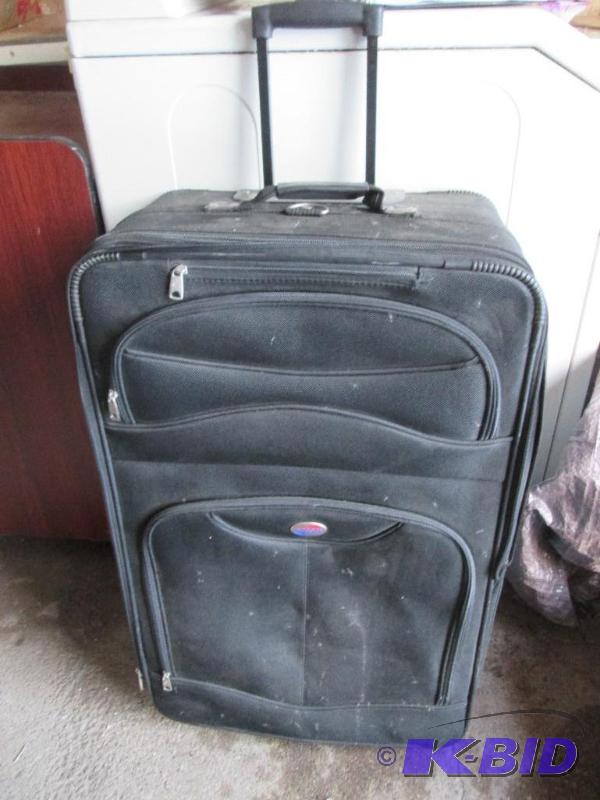 lot 67 image: American Tourister black suit case- used...