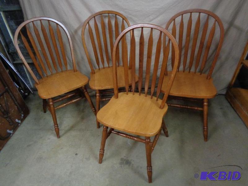 lot 19A image: 4 wood chairs. Marked made in Malaysia. Scuff...