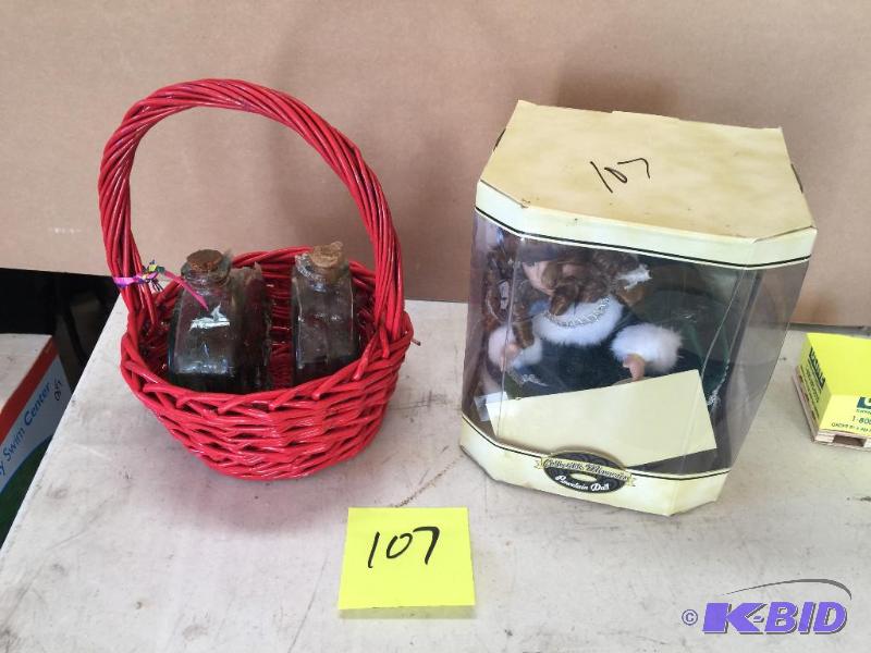 lot 107 image: Wicker basket and porcelain doll...