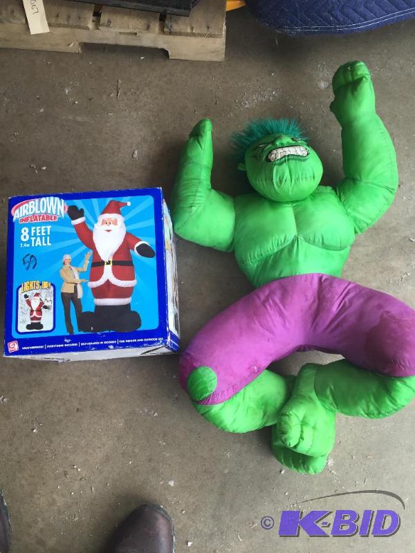 lot 59 image: 8 foot inflatable Santa and hulk doll...