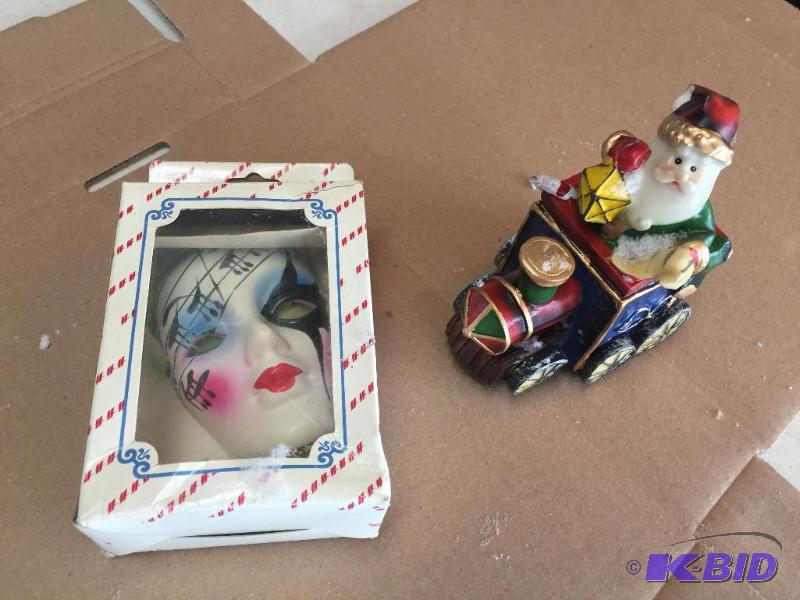 lot 73 image: Porcelain mask and Santa train...
