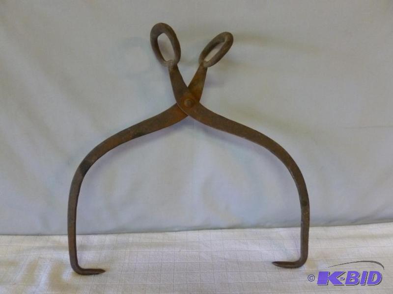 lot 123 image: Heavy duty ice tongs, measures 14" acros...